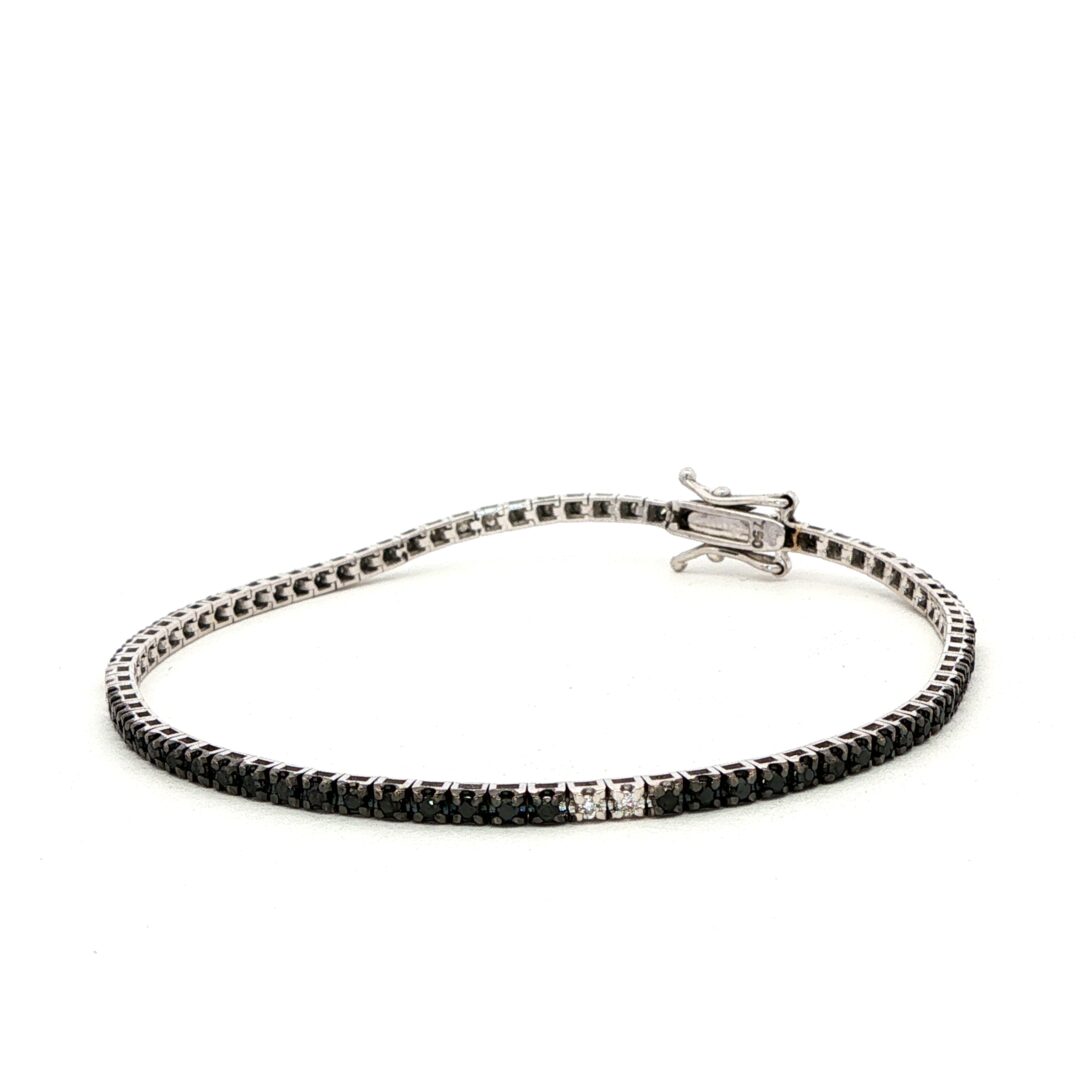 Bracciale tennis oro diamanti neri e bianchi laterale